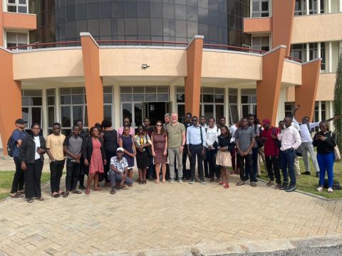 Group photo of the Gender Inclusion Meetup attendees outside the venue at Mbarara University of Science & Technology.